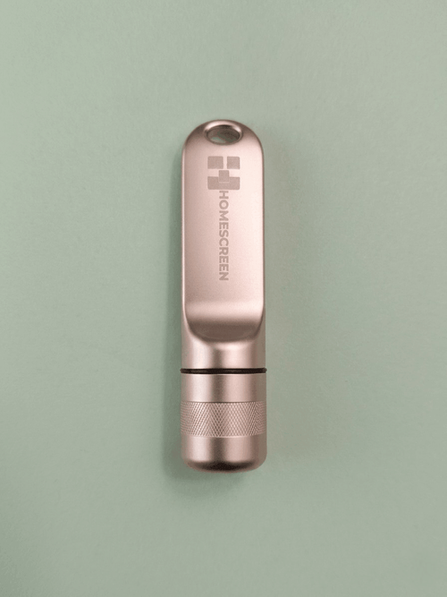 128GB portable USB drive with workspace on a mint green background.