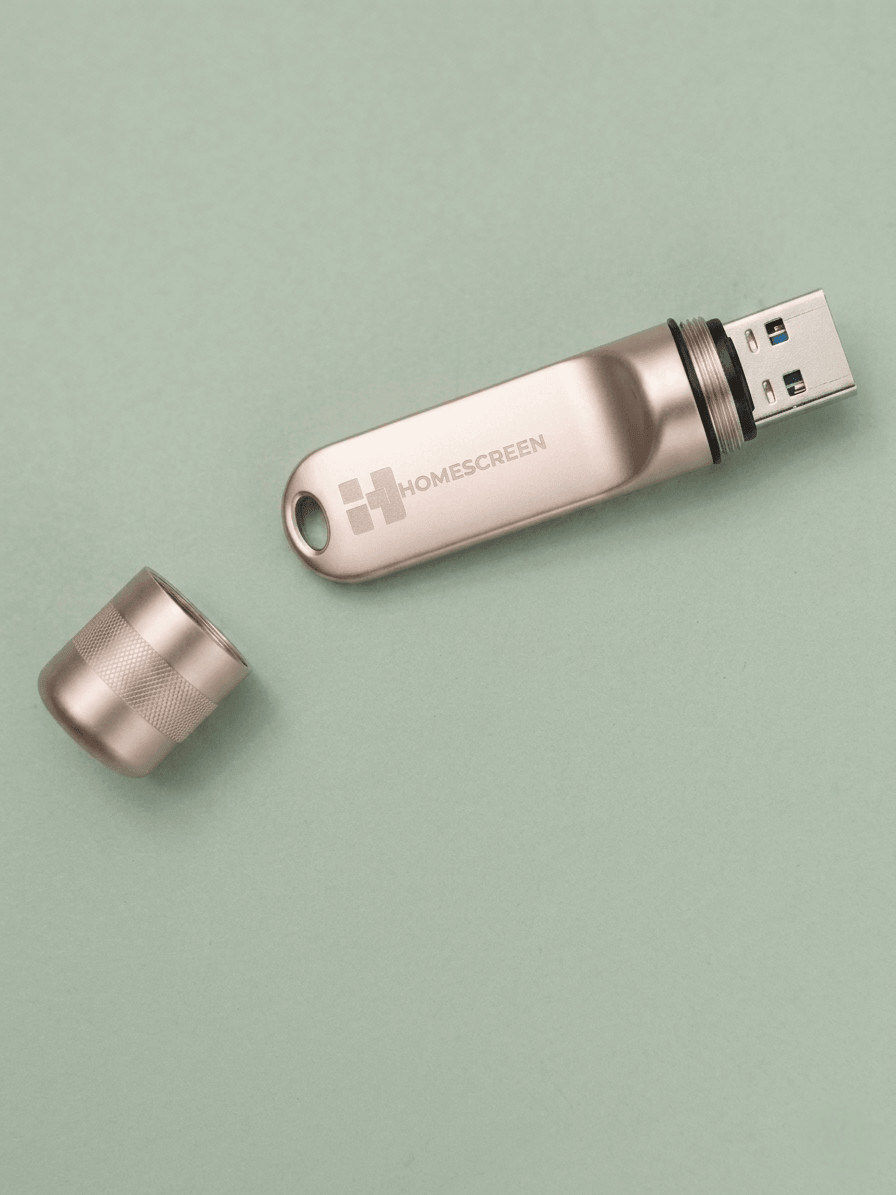 128GB portable USB drive with workspace on a green background.