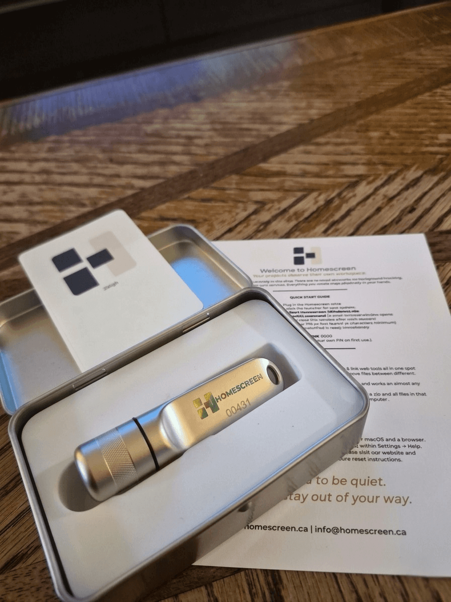 128GB portable USB drive with workspace displayed inside a metal case with a welcome note.